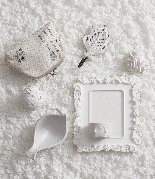 Decorative home accessory style with pillow and frame.