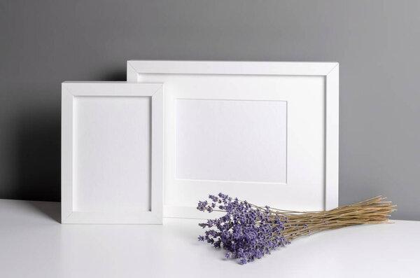 Frames mockup for photo or print presentation with lavender flowers. Minimalistics style indoor interior with artwork mockup.
