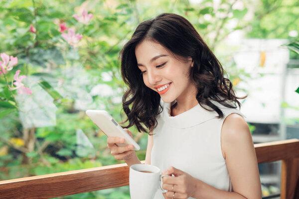 woman listening to smartphone