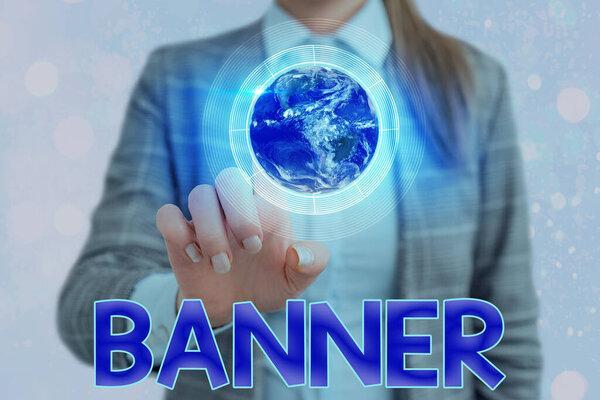 Handwriting text writing Banner. Concept meaning long strip cloth bearing slogan or design carried in public place Elements of this image furnished by NASA.