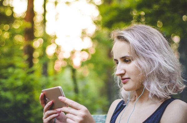 The girl is watching a video. Photo