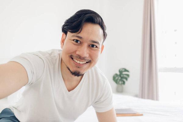 Innocences smile of happy man take selfie photo of himself.