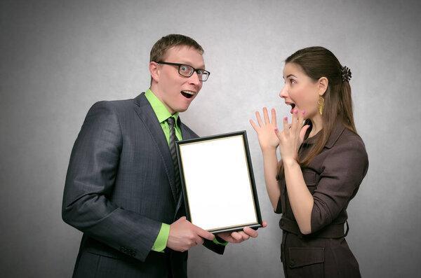 Awarding a diploma certificate to a best employee or student mock up. Winner award ceremony concept. One person handing a blank diploma with copy space to another person. Best worker or student.