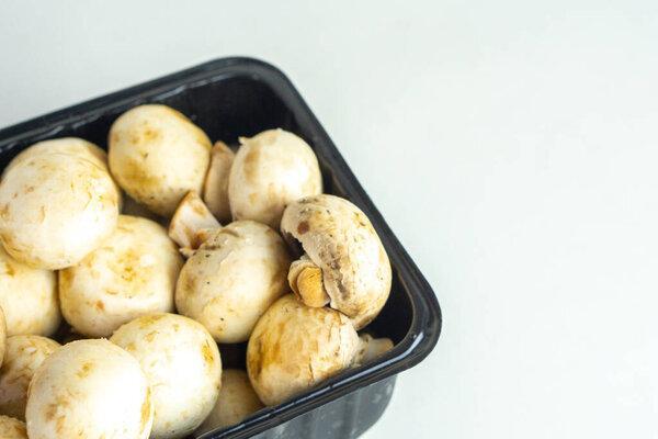 Fresh shiitake mushroom in box on isolated white background