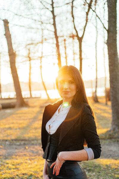 Beautiful business lady in a sunny park. Portrait