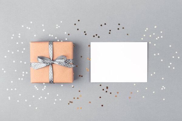 Gift box wrapped in kraft paper and white blank.