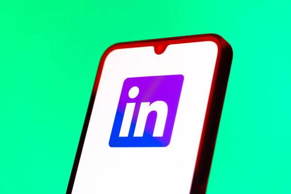 Prague, Czechia - 10 21 2024: Smartphone on surface showing LinkedIn logo.