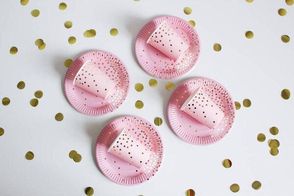 pink paper plates and cups