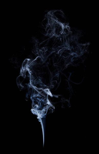 Photo of real white smoke on black background