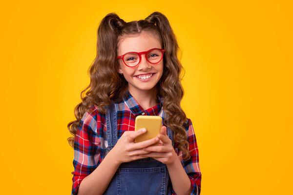 Happy teen girl using smartphone