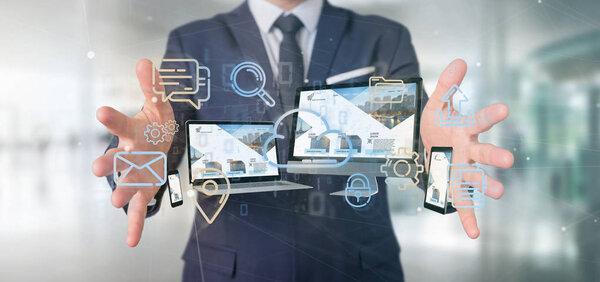 View of a Businessman holding a Devices connected to a cloud multimedia network 3d rendering