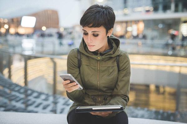 woman using smartphone and tablet,