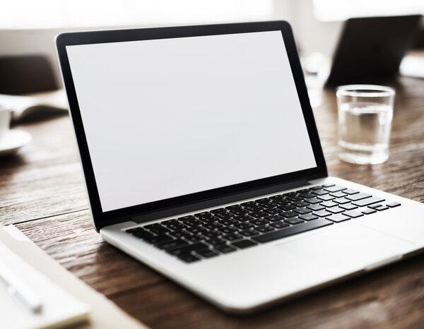 wooden table with laptop