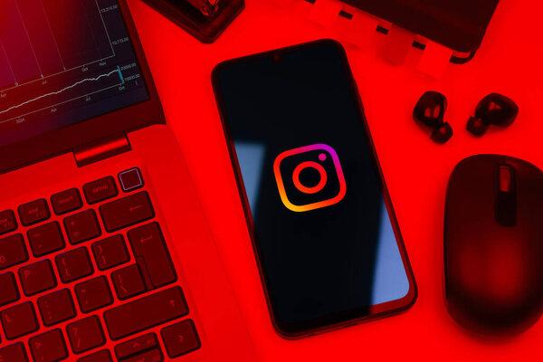 Prague, Czechia - 10 21 2024：Smartphone on surface showing Instagram logo.