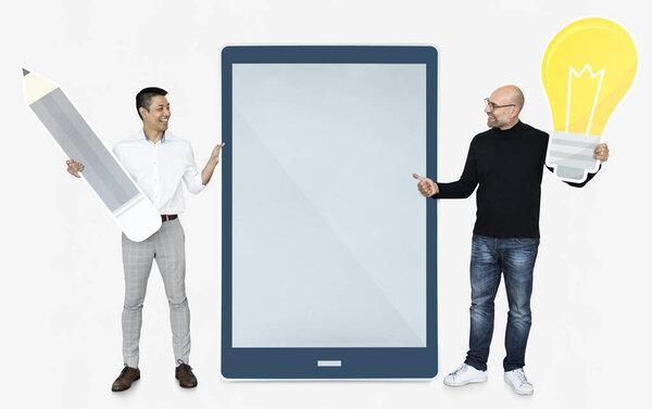 Creative men holding light bulb and a tablet 