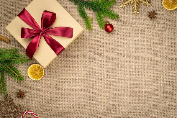 New Year Background Red decorations isolated on linen texture.Xmas celebration pattern.Holiday festive celebration concept.Banner mock up for display of product or design content