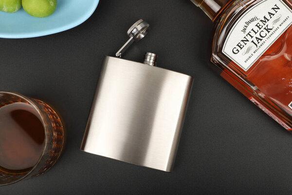 Diffirent colors stainless flask. Concept shot, top view. Custom background flask view. Flask and accessories.