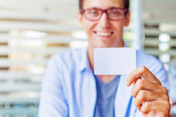 man holding blank name card. 