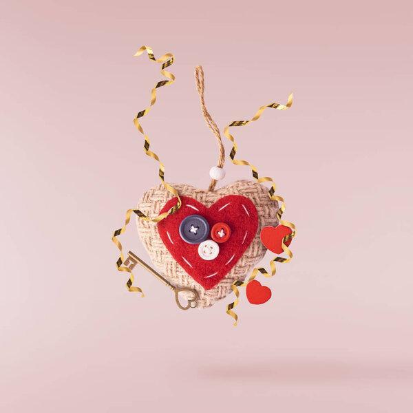 Valentines day concept.  Creative valentines day conception made by falling in air red hearts isolated on pink background