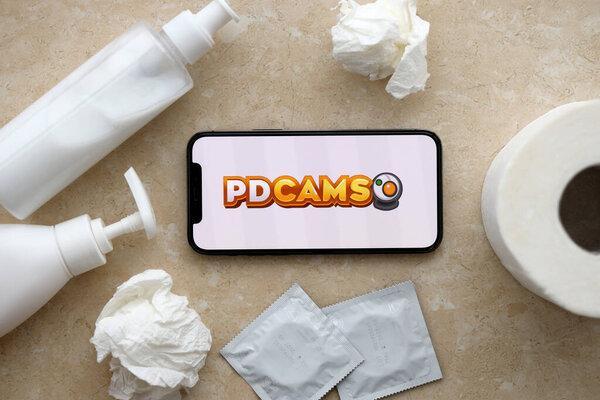 KYIV, UKRAINE - JANUARY 23, 2024 PDCams adult content website logo on display of iPhone 12 Pro smartphone