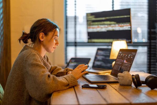 Woman works from cozy home office