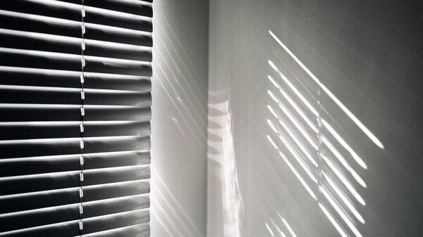 Architectural shadows. Sunlight architecture abstract background with light, black shadow overlay from window on white texture wall. Mockups, posters, stationary, wall art, design presentation